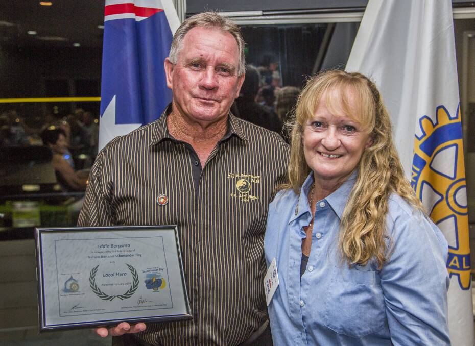 SERVICE NOTICED: Eddy Bergsma OAM, a co-founder of Fingal Beach Surf Life Saving Club, has been named as Rotary's third Tomaree Hero. Mr Bergsma is picture with Nelson Bay Rotary Club president Ann Evans. Picture: Henk Tobbe