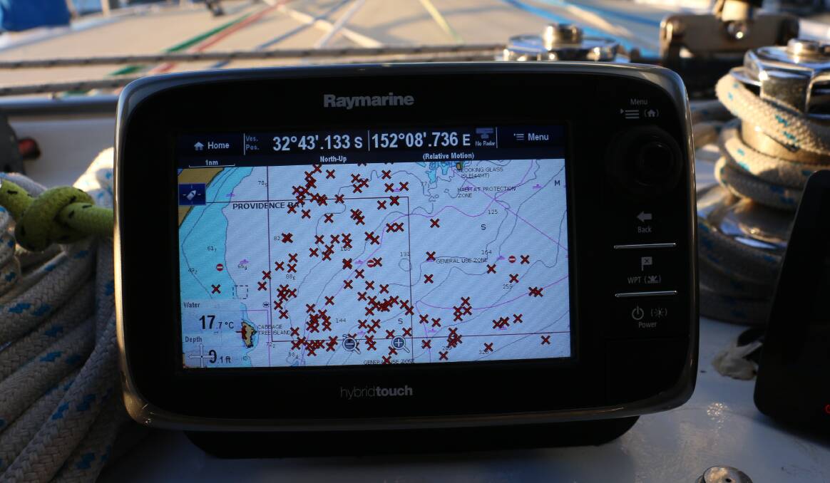 BAD SPOT: A photo of Frank Future's GPS. A red X is marked on the GPS each time a person is placed in the water with Dolphin Swim Australia. An application to move a fish farm to the middle of Cabbage Tree and Broughton Islands, where many people have been dropped in to swim with dolphins, has been made.