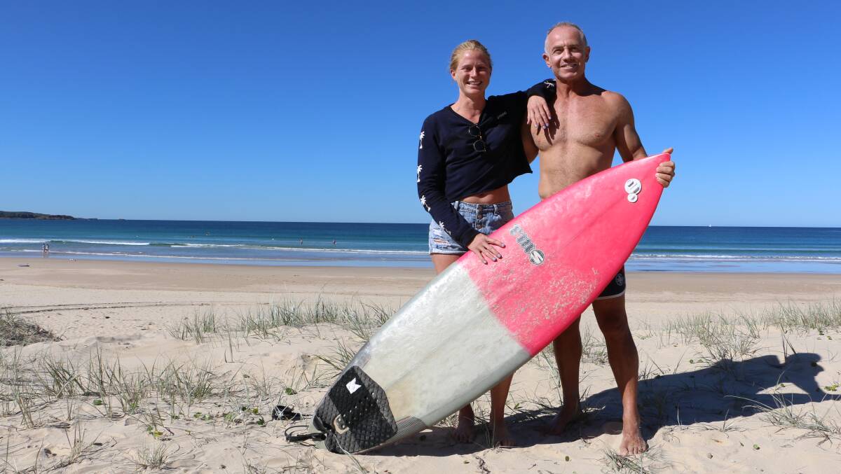 SURF'S UP: Fee Smith, a firefighter from Sydney, and Laurie Burden, a firie from Newcastle, took part in the Guns and Hoses surfing competition at One Mile Beach this week. Picture: Ellie-Marie Watts