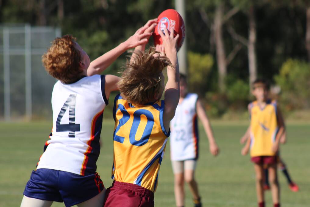 Action from the 2016 PSSA AFL state championship held in Nelson Bay. Pictures: Ellie-Marie Watts