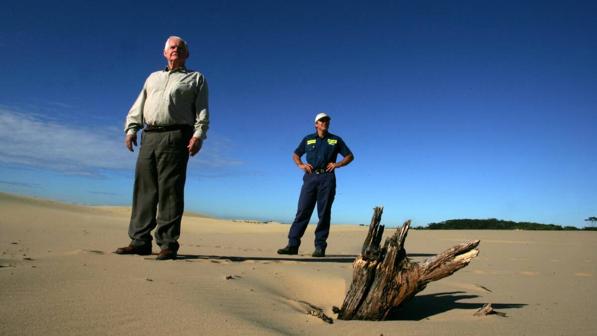 Action: Port Stephens mayor Bruce MacKenzie and his son Robert at Stockton sand dunes. Their company has been charged with use of their Salt Ash business, Macka's Sand, as an unlawful waste dump. 