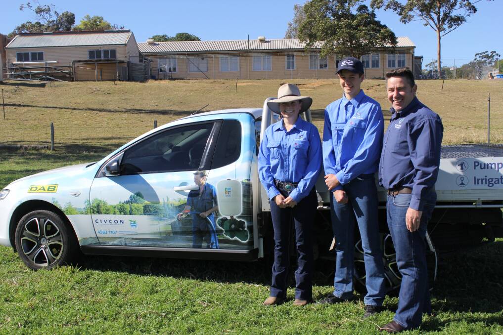HARD WORKING: Hunter River High School students Rachael Fisher and Sam Price, both 15, with Karl Atkin from Civcon. The students received the inaugural Civcon scholarship to help further their studies in agriculture.