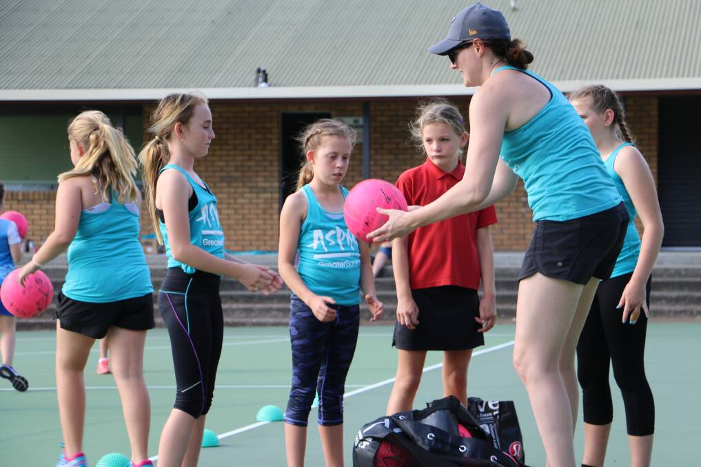 Professional netball player Sam Poolman is running a three day clinic for Bay netballers in Nelson Bay this month. Pictures, by Ellie-Marie Watts, show Poolman training Nelson Bay Netball Association's under-10 and 11 girls on November 3.