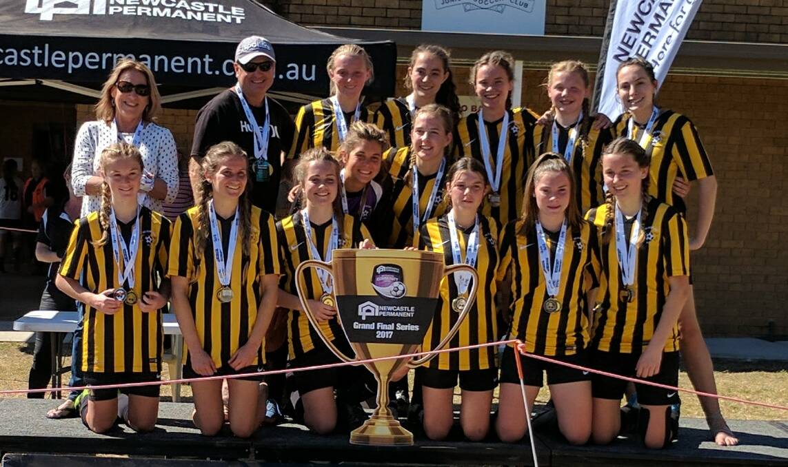 HAPPY: Nelson Bay Football Club's under-18 girls were undefeated all year. They finished the year as both minor and major premiers.