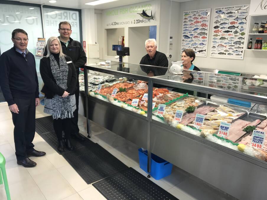 CASH INJECTION: Scot MacDonald, parliamentary secretary for the Hunter, Carmel Foster, acting general manager of Port Stephens Council, Danny Eather from Destination Port Stephens with Narelle and Bob Monin, owners of Nelson Bay Fish Market.