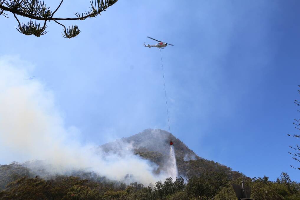 Photos of the fire and Wednesday morning's helicopter operation to extinguish the flames.