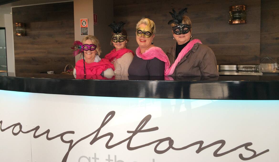 READY: Tomaree Breast Cancer Support Group members at Broughtons at the Bay, where the masquerade ball will be held. Picture: Kim Blanch