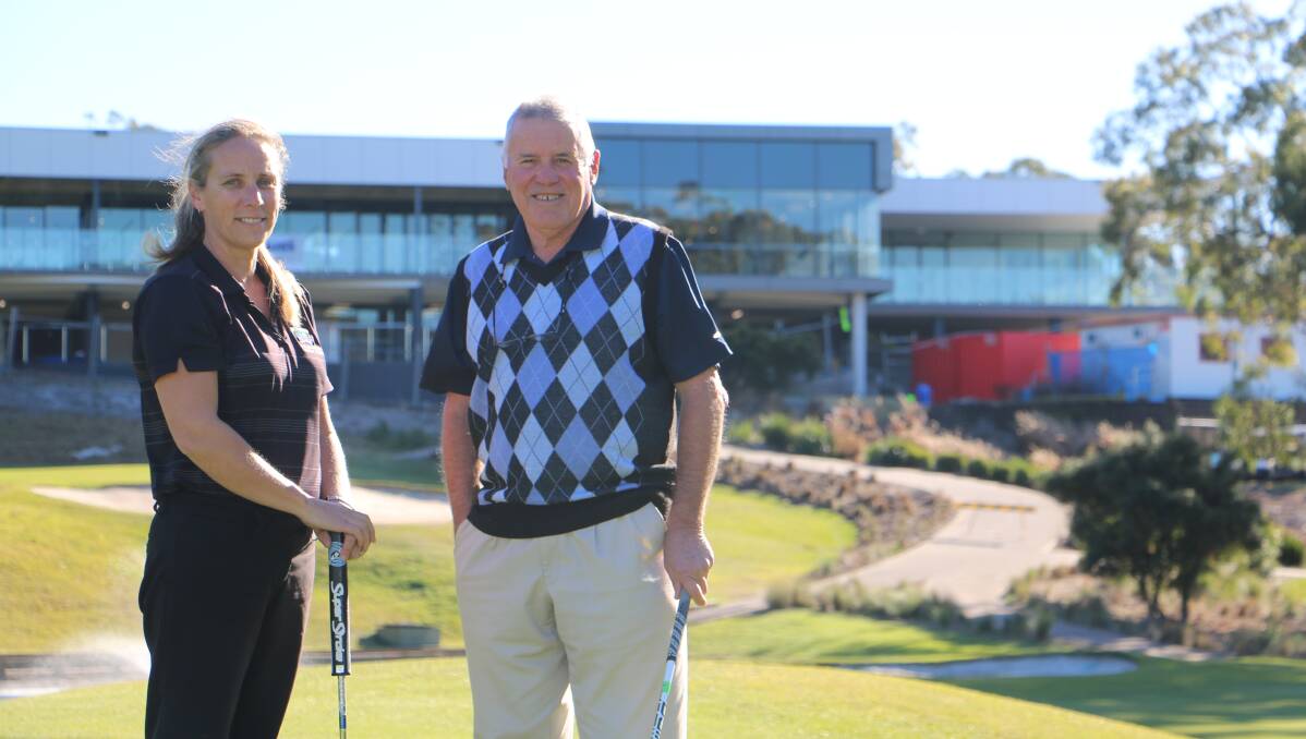 EXCITED: Penny Whatman, the office manager at Nelson Bay Golf Club, with president Max Pride. The rebuild is almost complete. Pictures: Ellie-Marie Watts