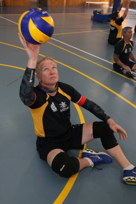 HARD WORK: Squadron Leader Danny Jeffery playing seated volleyball, which he will compete in if selected for the 2017 Invictus Games. 