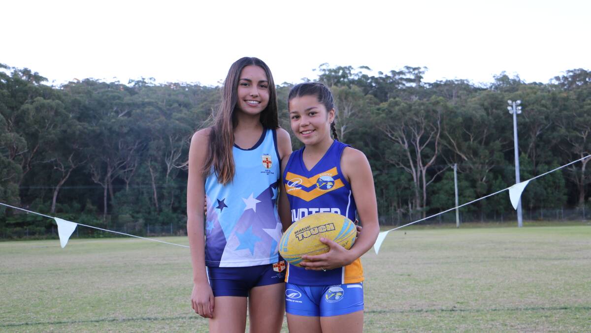 Andi Law, 14, and Ava Forster, 11, at the Nelson Bay touch fields. Picture: Ellie-Marie Watts
