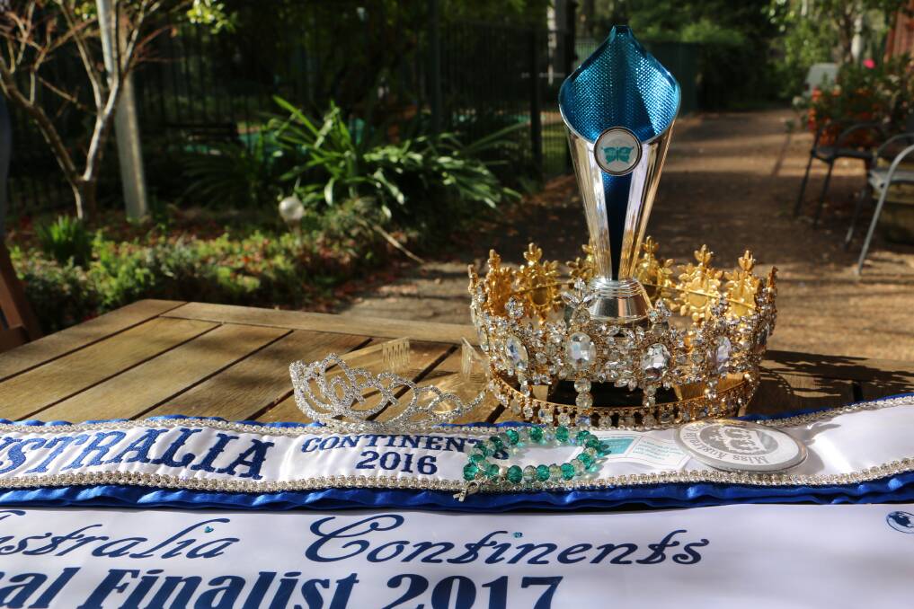 Some of Jasmine Farlow's recent win 'spoils' - a trophy, crowns and sashes. 