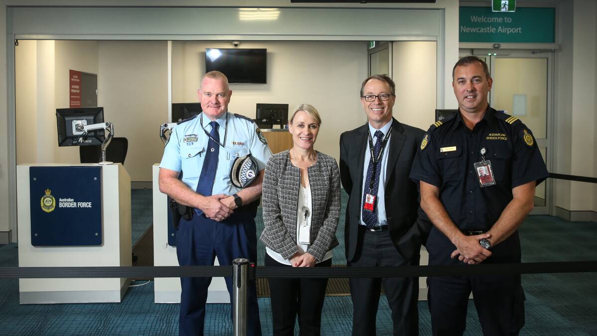 Working together at Newcastle Airport's new international gate is, from left, NSW Police Superintendent Craig Jackson, Inger Nieuwkamp from Department of Agriculture and Water Resources, Newcastle Airport CEO Dr Peter Cock and Australian Border Force's Damian McKay, District Manager Newcastle Maritime Operations. Picture: Marina Neil