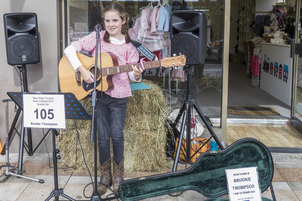 TALENTED: Brooke Thompson, 10, pictured in Nelson Bay on Saturday, won the junior section of the festival's busking competition. Picture: Henk Tobbe
