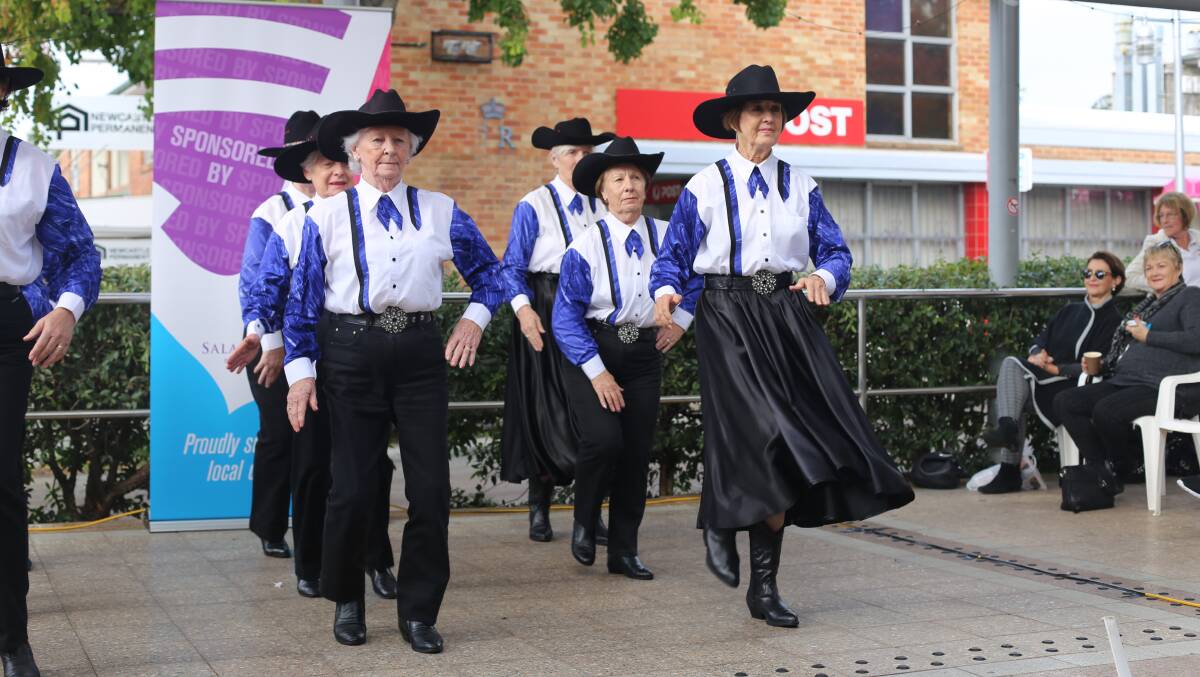 The Central Coast Bootscooters doing a line dancing demonstration on the Stockton Street stage in the Nelson Bay CBD during last year's festival. Picture: Ellie-Marie Watts