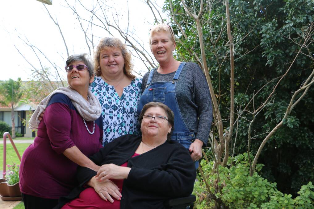 HOMELY: Glynnis Eick and Jenny Field (front) are residents of Tomaree Accommodation Services' house in Salamander Bay. They are supported by carers Joanne Foote and Amanda Smith (back). Picture: Ellie-Marie Watts