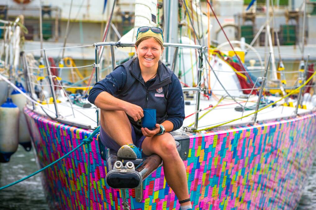 Lisa Blair sitting on the bow of her yacht at Portland. Picture: Dean Coopman