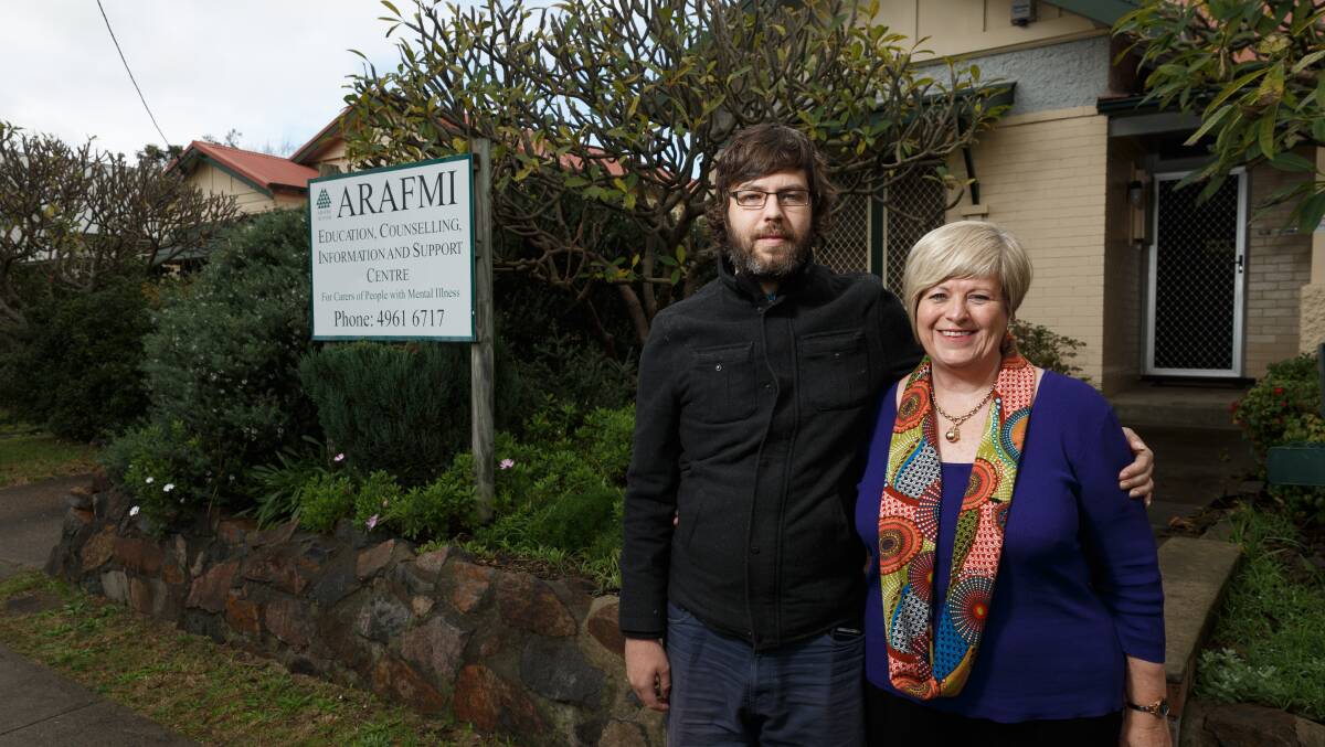 LISTENING: Peter Cross with his mother, Janette Dempsey, who is the Hunter president of  the Association of Relatives and Friends of People with Mental Illness (ARAFMI), outside the support group's headquarters. Picture: Max Mason-Hubers