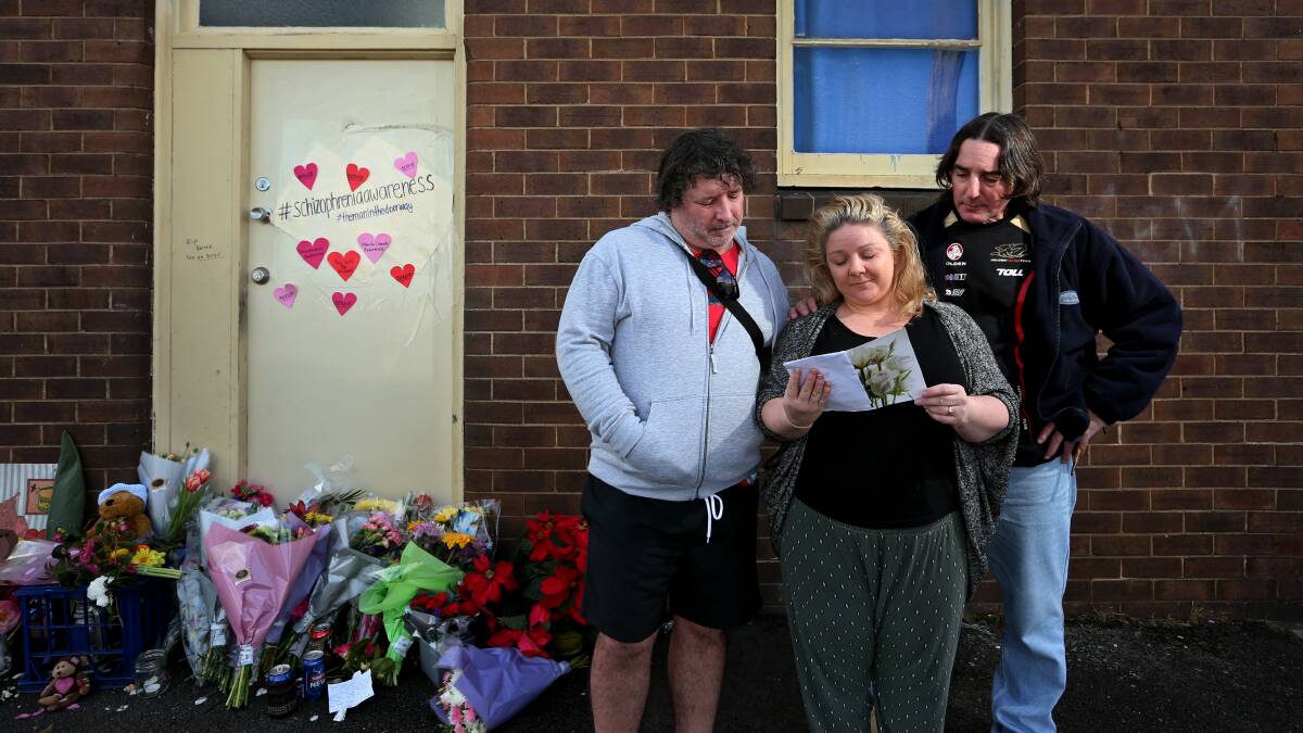 HONOURING BERNIE: Jenny Allen (centre), with David Sessions and Michael Sessions, read tributes for their brother, Bernie Sessions, widely known as Mayfield's Man in the Doorway. Picture: Simone De Peak