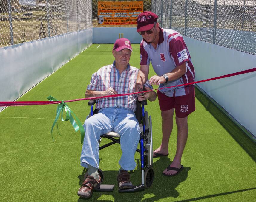 READY FOR ACTION: Club patron Bob Freeman cuts the ribbon to officially open the nets.