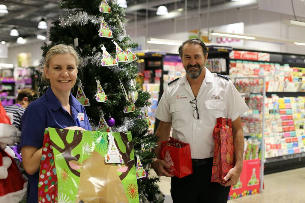 CHRISTMAS SPIRIT: Kmart Wishing Tree Appeal co-ordinator Jodie Smith with Salvation Army envoy Howard Koutnik. Picture: Ellie-Marie Watts