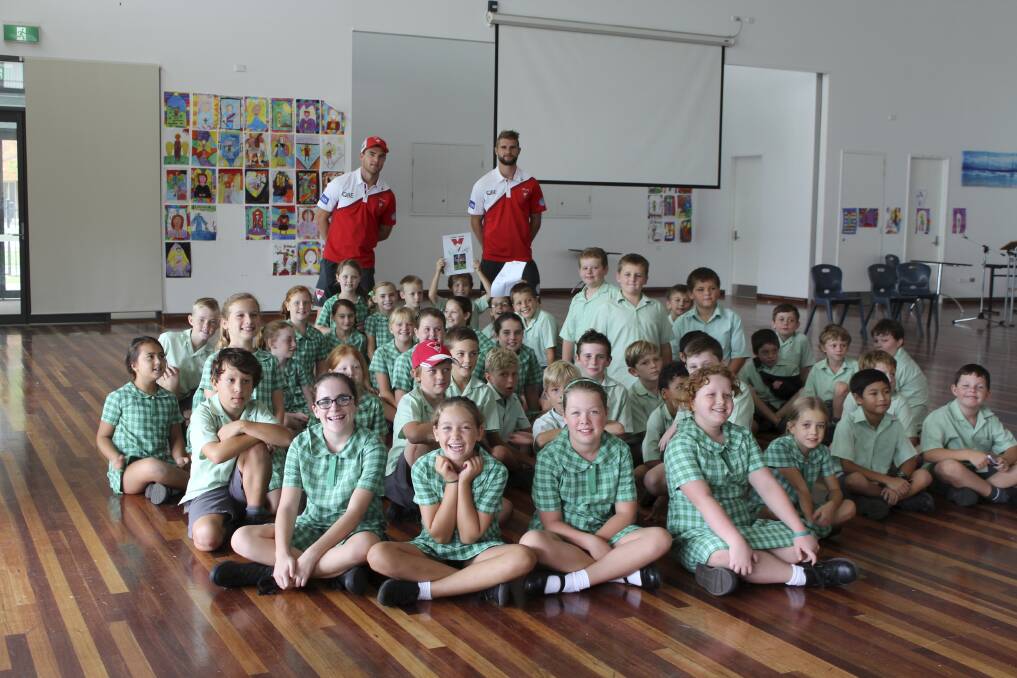 EXPERT TIPS: St Michael's students with Swans stars Tom Mitchell and Harry Marsh. Picture: Supplied