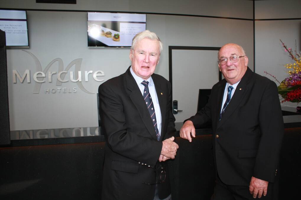 HOP ABOARD: Rear Admiral Peter Sinclair with developer Hilton Grugeon at the Mercure Hotel opening. Picture: Stephen Wark