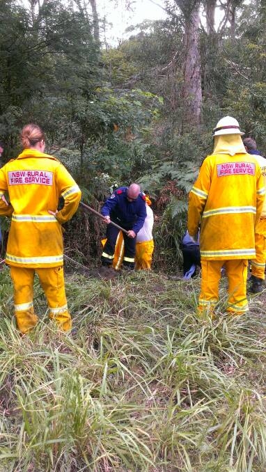RARE TEST: Anna Bay Rural Fire Service and Nelson Bay NSW Fire and Rescue at the scene of a rescue at Bobs Farm, where a horse was stuck down a drain. Picture: Supplied by Anna Bay RFS