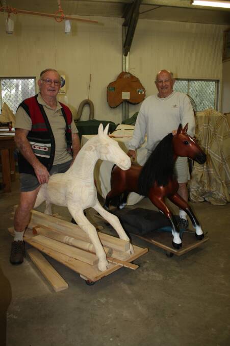 CREATIVE: Port Stephens Community Arts Centre woodworkers Geoff McClelland and Charlie Kuhn horsing around.