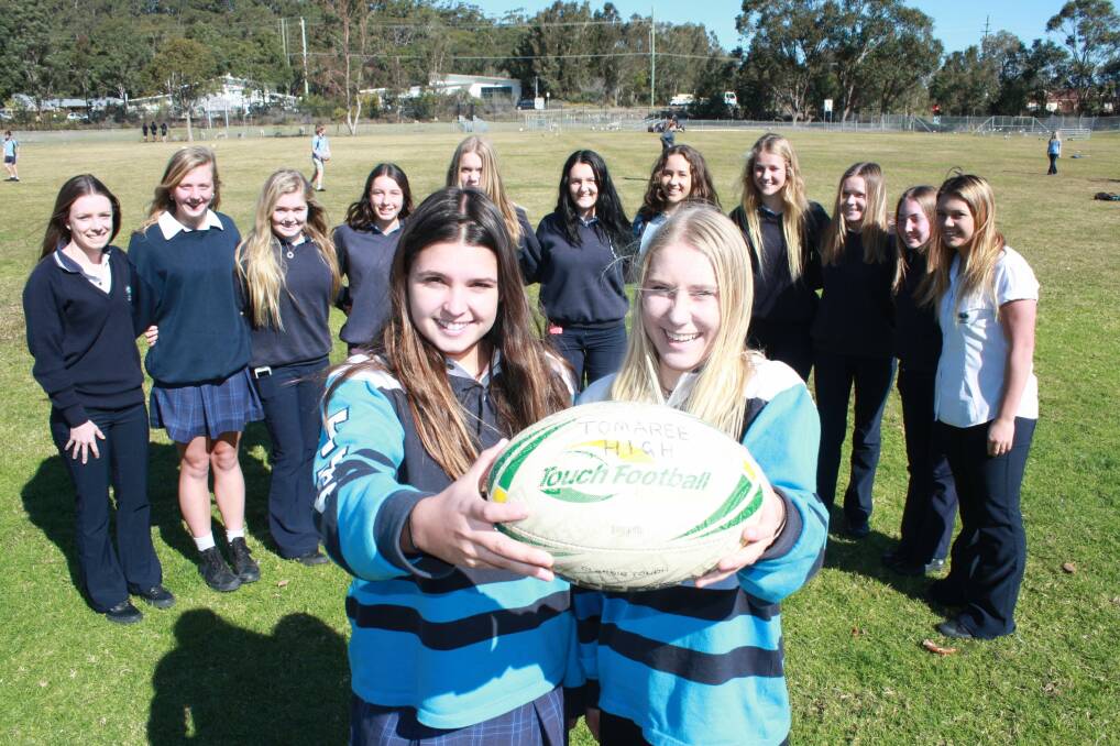 RIGHT TOUCH: Bobbi Law and Haley West, both 18, with the Tomaree High touch footy team. Picture: Stephen Wark