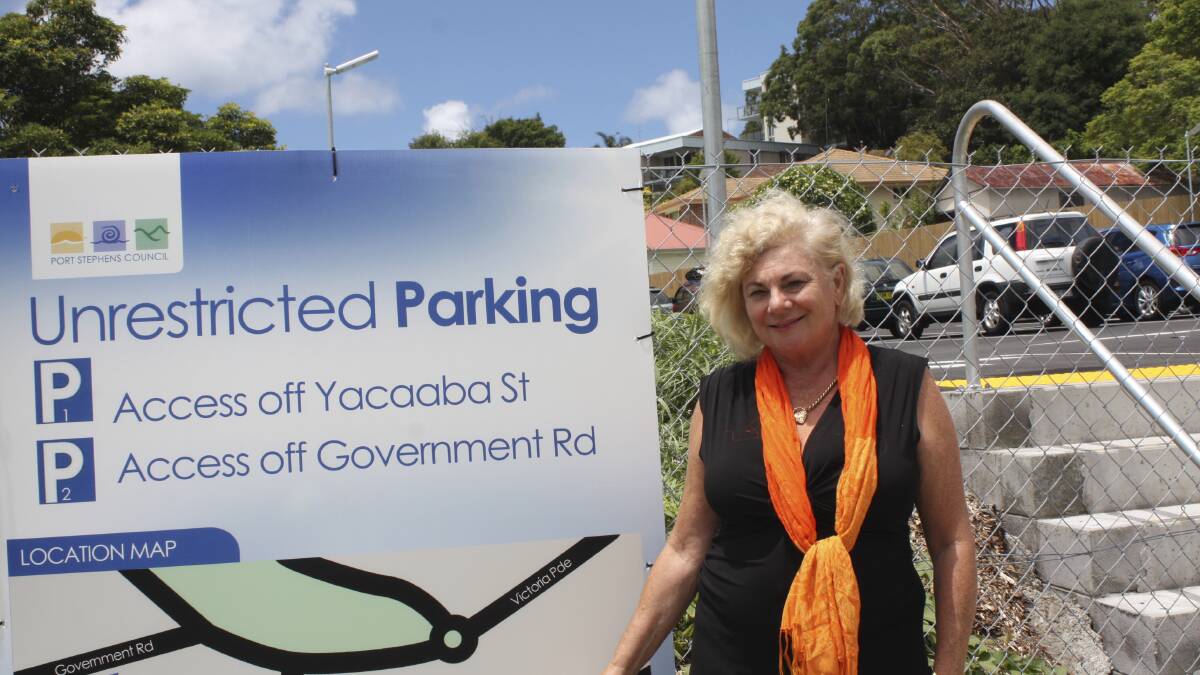 THIS WAY: Denise Sharp at the foot entrance sign to the Magnus Street car park. Picture: Charles Elias