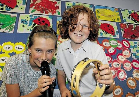 REHEARSING: Haley Martin, left, and Kaleb Williams, both 11, prepare for Amplified, Mount Kanwary Public School's fund-raising event. Picture: Stephen Wark