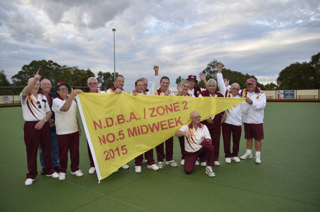 WINNERS: The Fingal Bay men's mid-week bowlers have won the Newcastle District Bowling Association zone two grade five pennant flag.