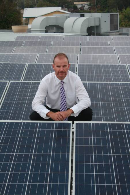 HOT STUFF: Simon Lack with the club's solar panels.Picture: Stephen Wark