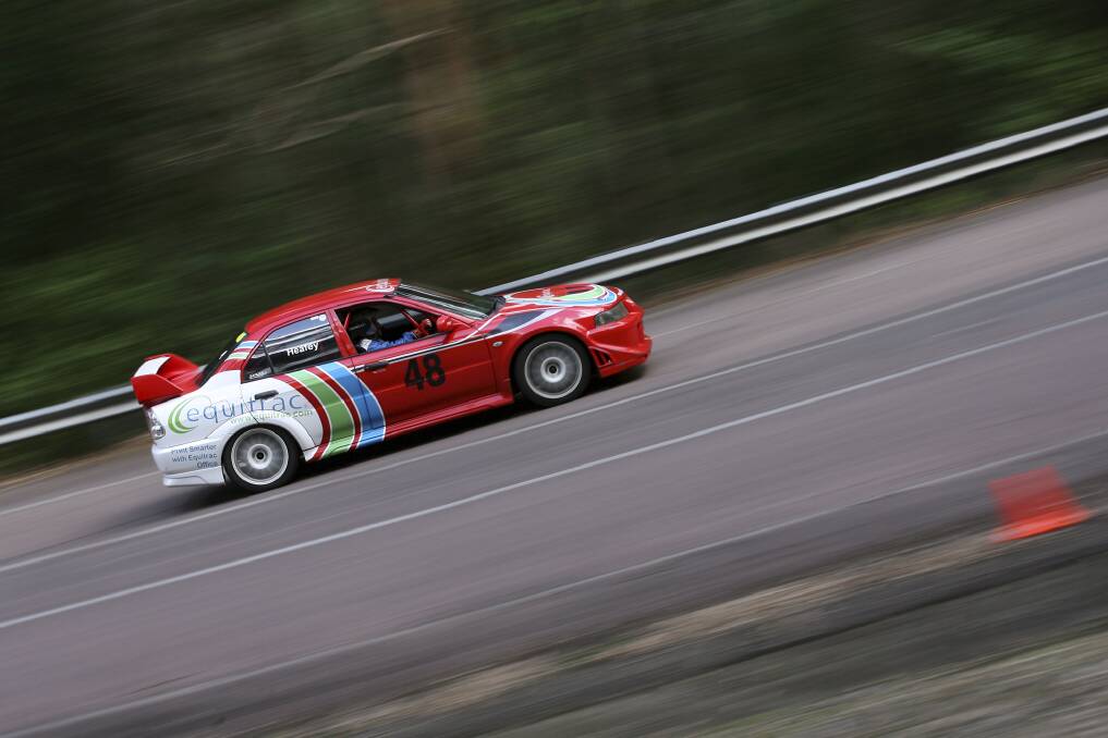 FLOORING IT: Phil Heafey in the Evo6 fastest sedan which completed the hill climb in 30.3 seconds.