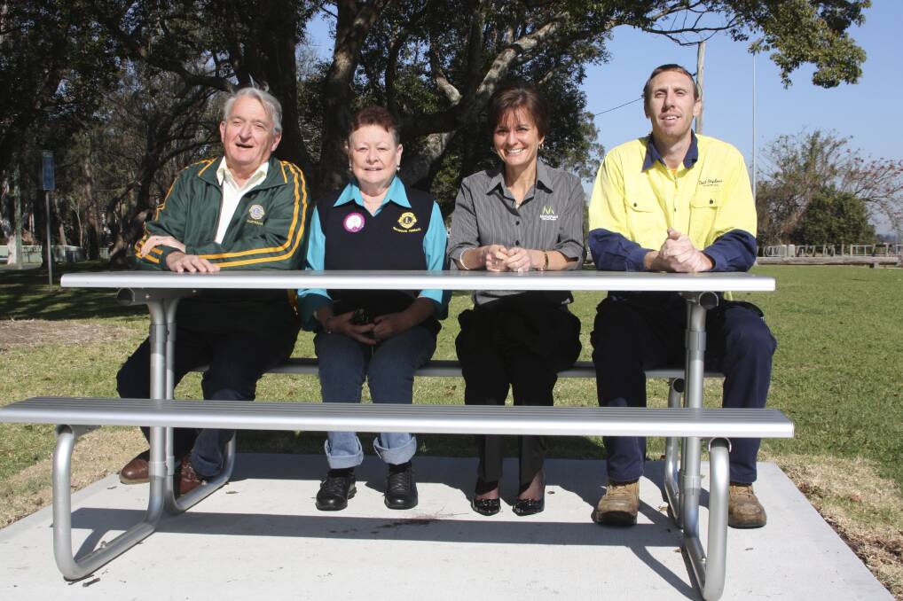 HANDS-ON: Bob Findley and Jules Brell from the Raymond Terrace Lions, Colleen Mulholland-Ruiz from Marketplace and the council's David Roberts.