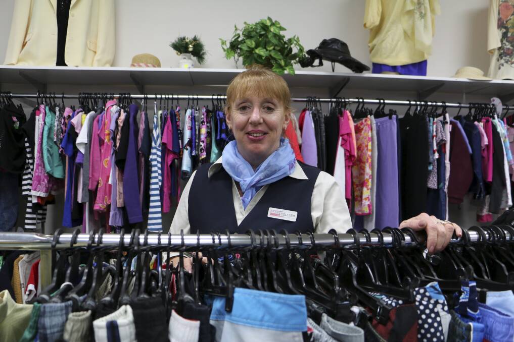 GOOD BUYS: Colleen Ingram with what's on show at Raymond Terrace Salvos. Picture: Jessica Brown