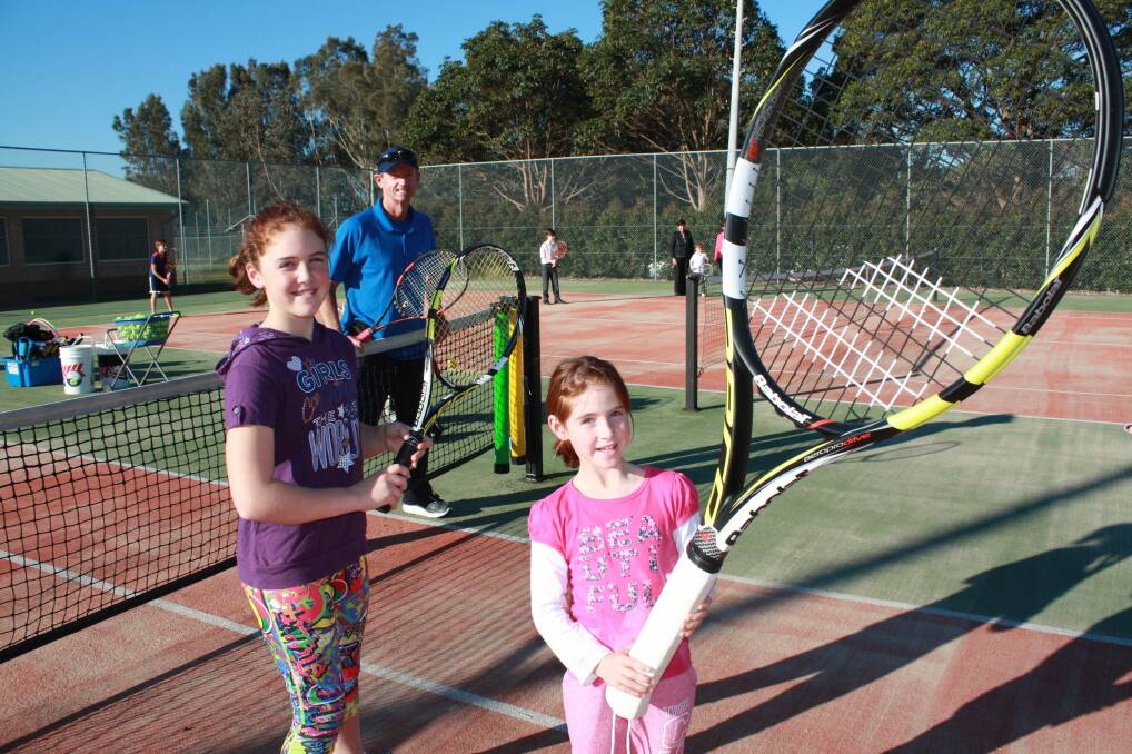 WHAT A RACKET: Eve Crowe, 10, Jasmine Crowe, 7, and Peter Doohan, at Fingal Bay Tennis Court. Picture: Stephen Wark