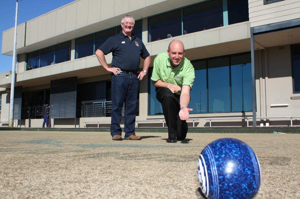 HUGE HELP: Newcastle-Hunter Men of League Foundation treasurer Chris Kelly with Nelson Bay Bowling Club's operations and bowls manager Richard Girvan. Picture: Ellie-Marie Watts