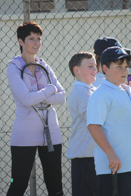 MATCH PLAY: Port Stephens MP Kate Washington plays tennis with Anna Bay Public School students at Boat Harbour tennis courts. Picture: Tina Custer