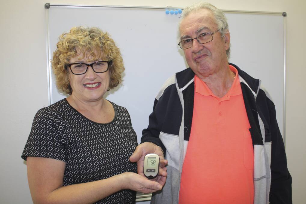 ON TO IT: John Robinson is checked out by diabetes educator Annabel Thurlow at her Nelson Bay clinic. Picture: Charles Elias