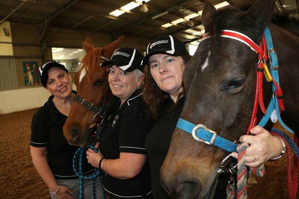 COMMUNITY SUPPORT: From left, Kathryn Rodway, Mandie Newell and Susan Watts at Riding for the Disabled. Picture: Stephen Wark