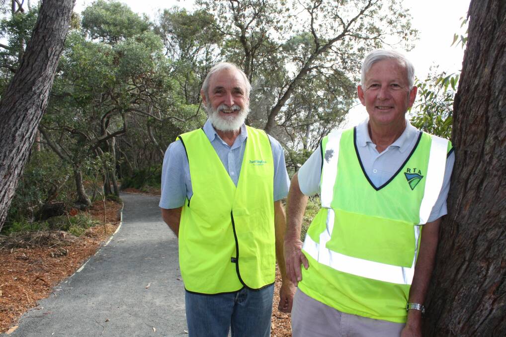 PHASE ONE: Peter Thomas and Peter Dunkley on the path the Shoal Bay Community Association are constructing along the waterfront. Picture: Stephen Wark