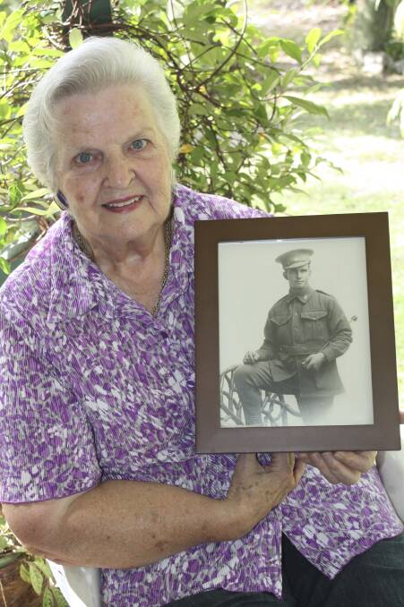 WAR SERVICE: Anna Bay's Eve Ross with a picture of her late father, Joseph Robinson. Picture: Charles Elias
