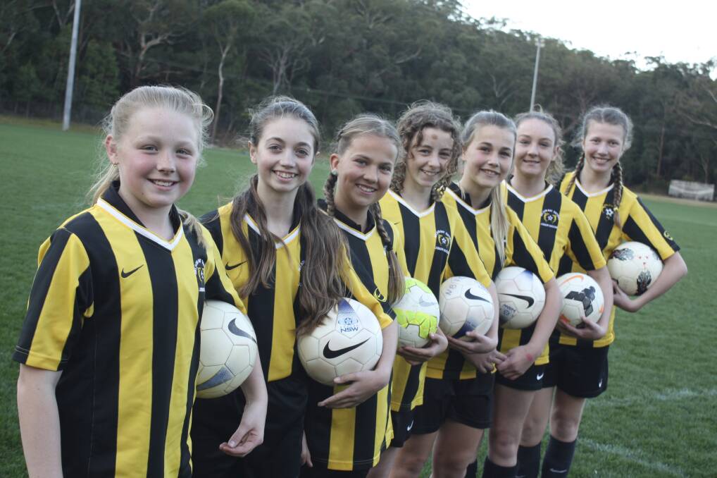 UNDEFEATED: Nelson Bay's Newcastle reps Jade Graham, 11, Sky Wood, 11, Abbey Cave, 12, Tara Knight, 12, Hayley Moore, 12, Taylah Knight, 14, and Tara Helly, 12, at Tomaree soccer fields.