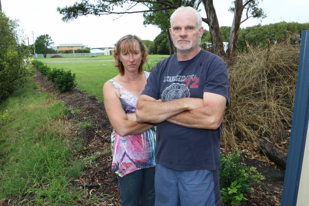 ANGRY: Jennine Holland and Graham Kirk at their property in Salt Ash. Picture: Stephen Wark