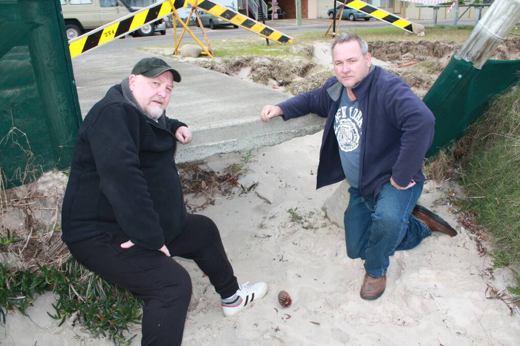 WORRIED: Residents Grant Smith and Rod Schramm near the exposed footpath at Fly Point. Picture: Stephen Wark