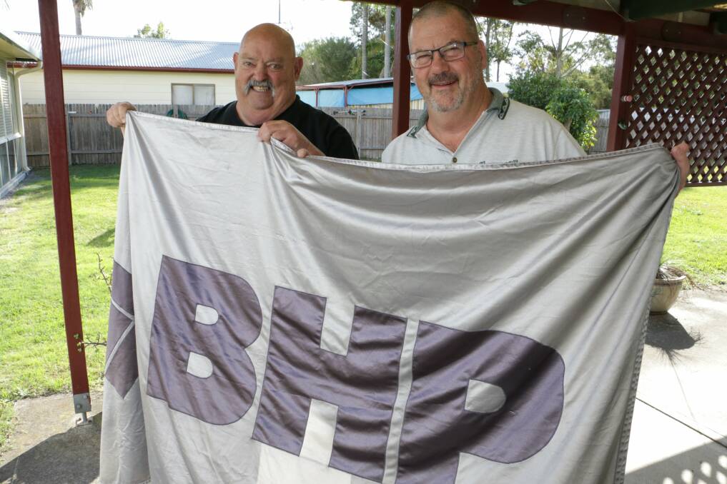 REMEMBER WHEN: Aubrey Brooks and Bob Newitt with some BHP memorabilia. Picture: Stephen Wark