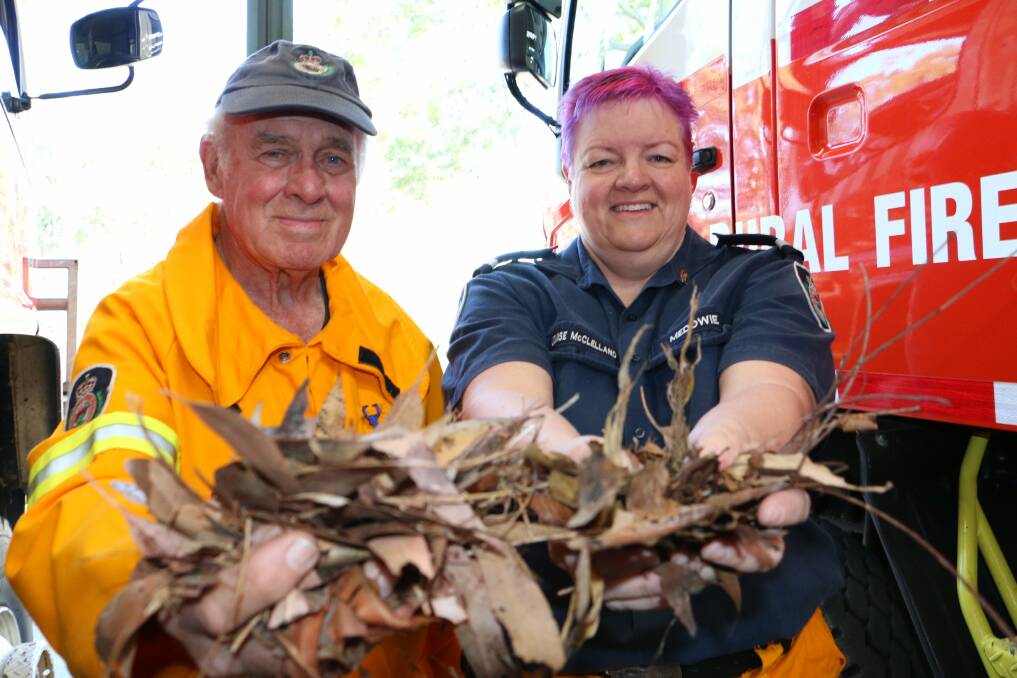 FUEL: Medowie Rural Fire Service members Bob Melehan and Louise McClelland. Picture: Stephen Wark