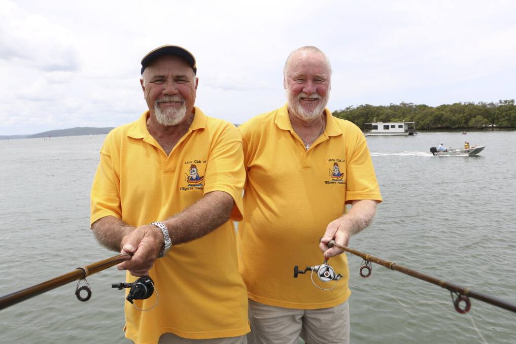 LION HEART: Tilligerry Lions Club members Mike Miles and Bob Royal, on right, at Lemon Tree Passage in January 2015.