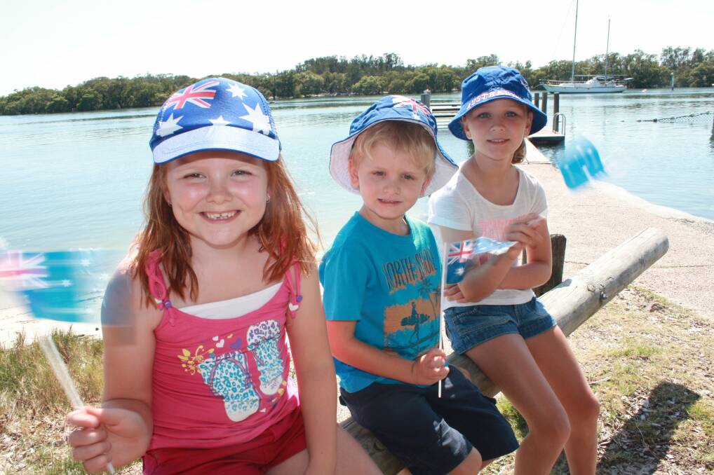 CAN'T WAIT: Charlee Sheather, 7, Mitchell Humbles, 5, and Emma Zdebski, 8, all of Tanilba Bay, prepare for Australia Day activities at Henderson Park. Picture: Stephen Wark